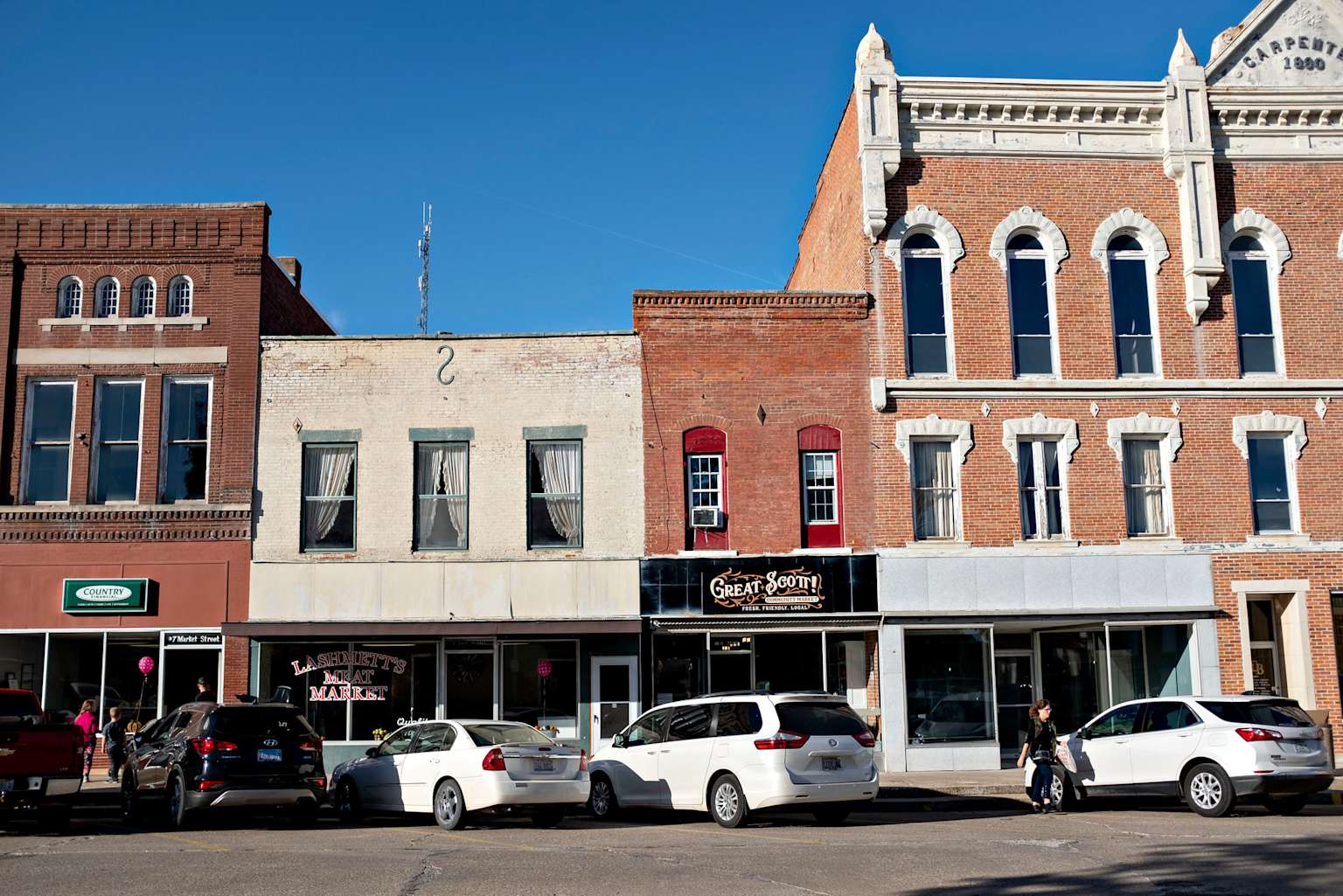 Small-town retail storefronts in rural America showcasing local businesses and community markets